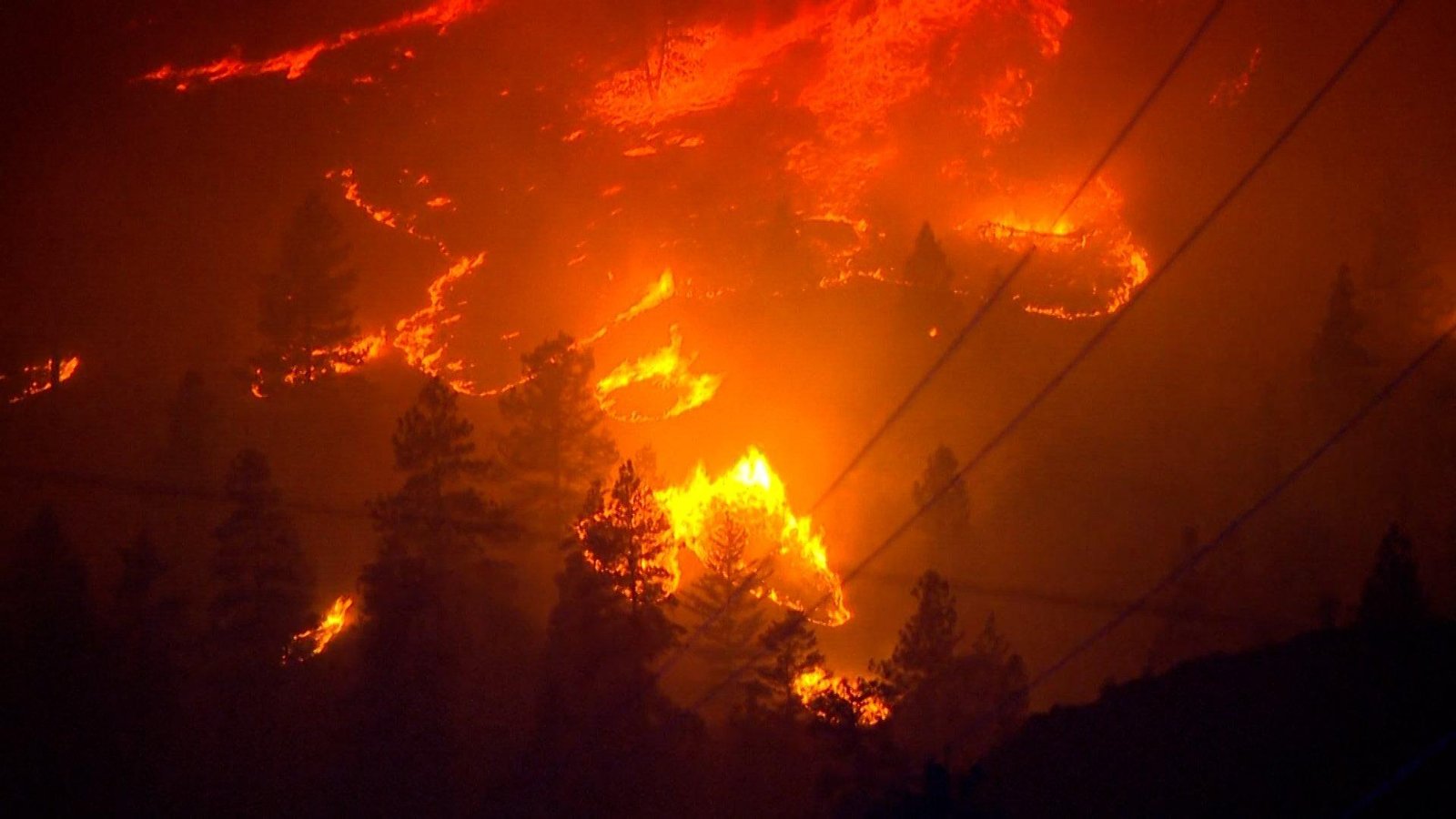 Wildfires bear down on homes i...