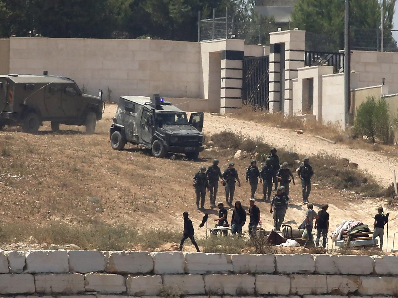 Israeli settlers besiege three...