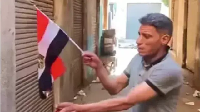 الأمن يفحص فيديو إحراق العلم ا...